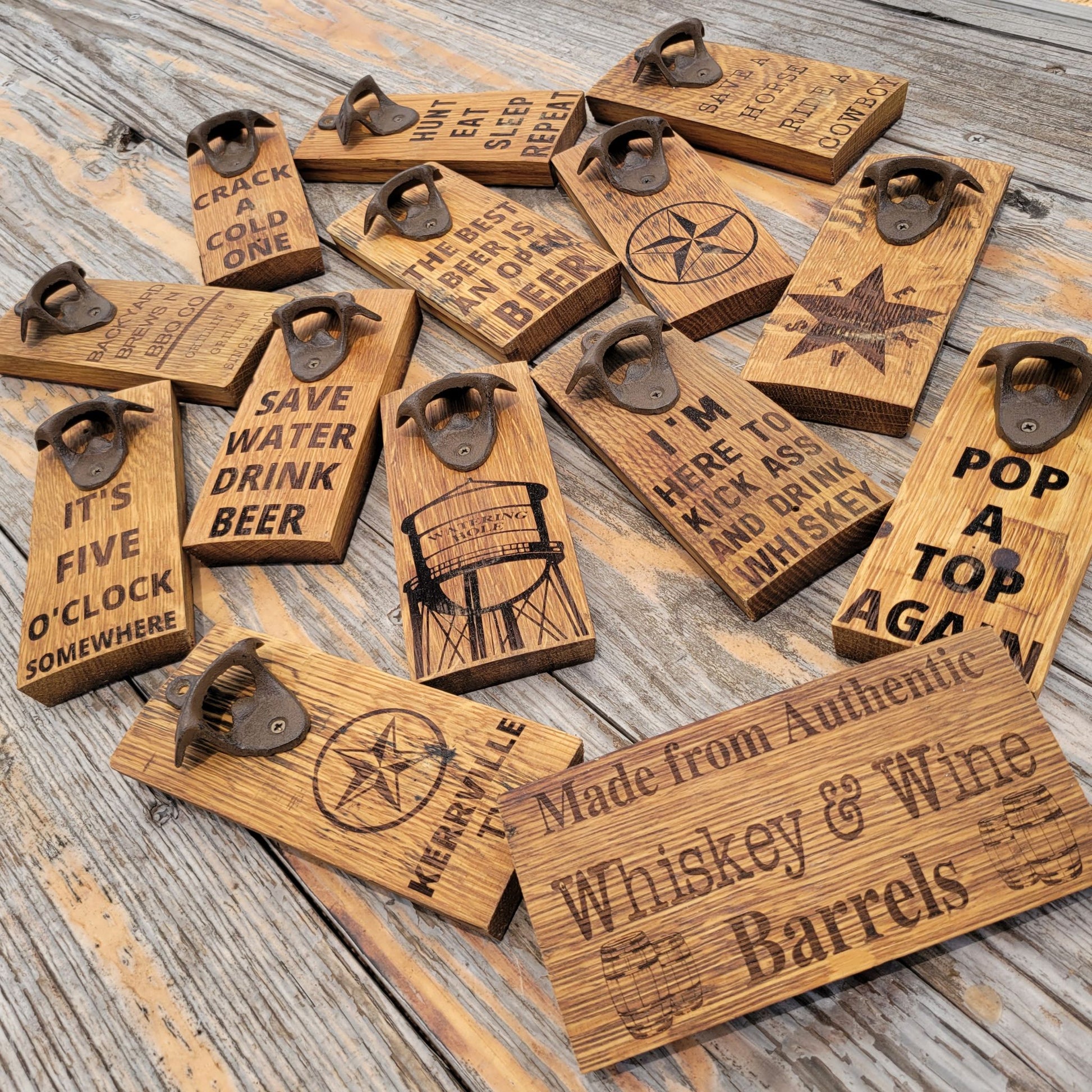 A variety of wall hanging bottle openers made from authentic whiskey & wine barrels.