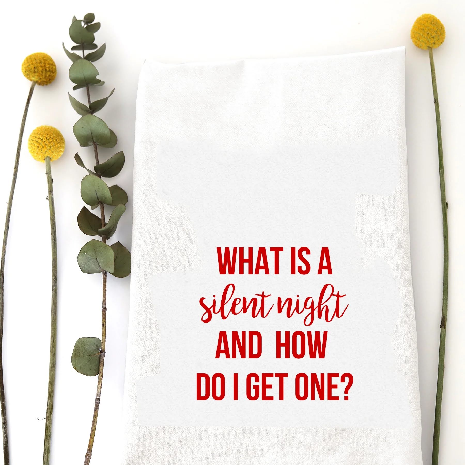A holiday tea towel with the words "What is a silent night and how do I get one?" printed on it.