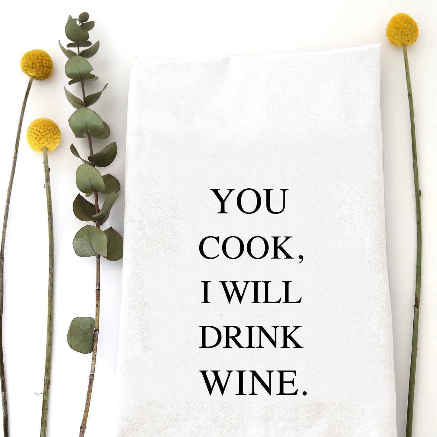 A tea towel with funny saying - you cook, I will drink wine.