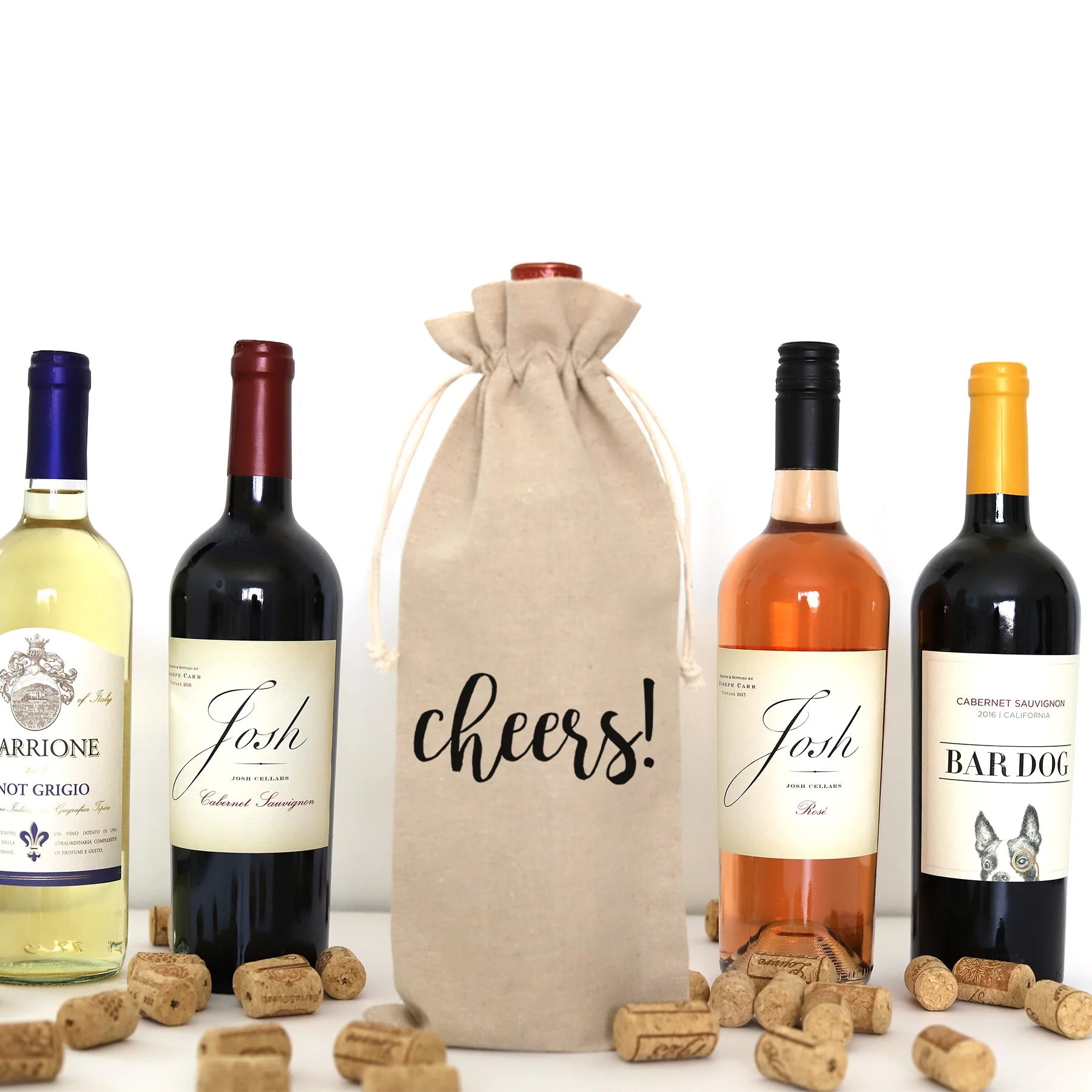A wine bag with the words "Cheers!" printed on it.