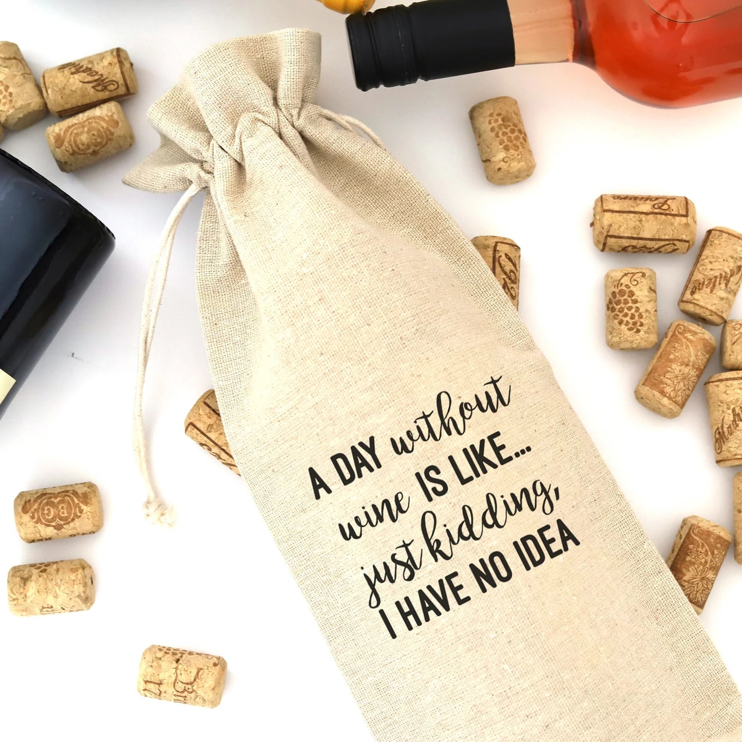 A wine bag with the words "A day without wine is like... just kidding, I have no idea" printed on it.