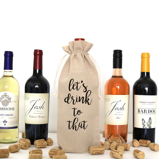 A wine bag with the words "let's drink to that" printed on it.