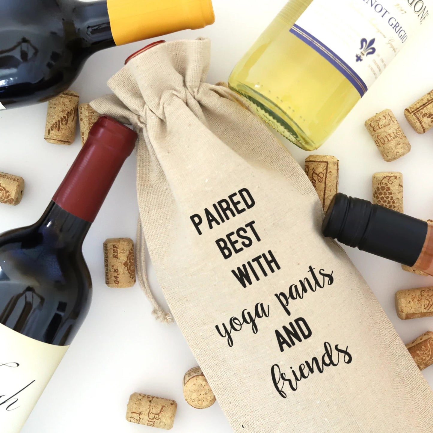 A wine bag with the words "Paired best with yoga pants and friend" printed on it.